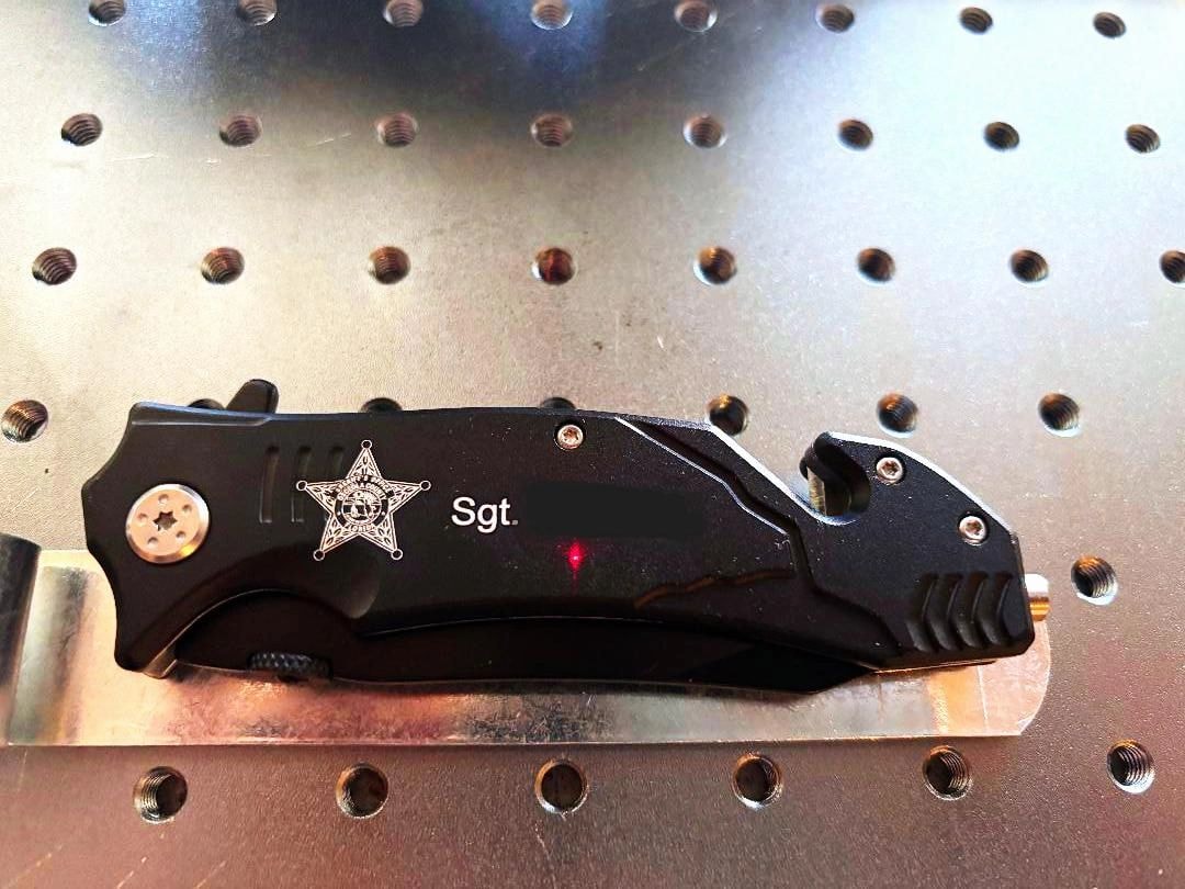 Engraved tactical knife